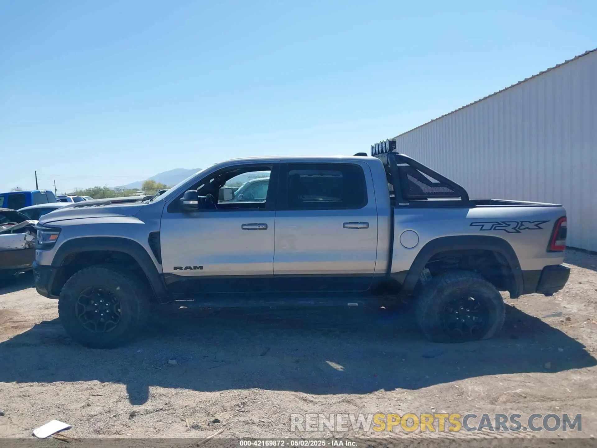 13 Photograph of a damaged car 1C6SRFU99NN357351 RAM 1500 2022