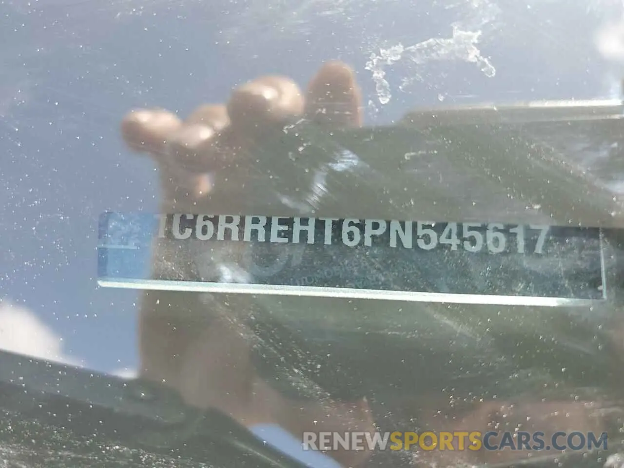 12 Photograph of a damaged car 1C6RREHT6PN545617 RAM 1500 2023