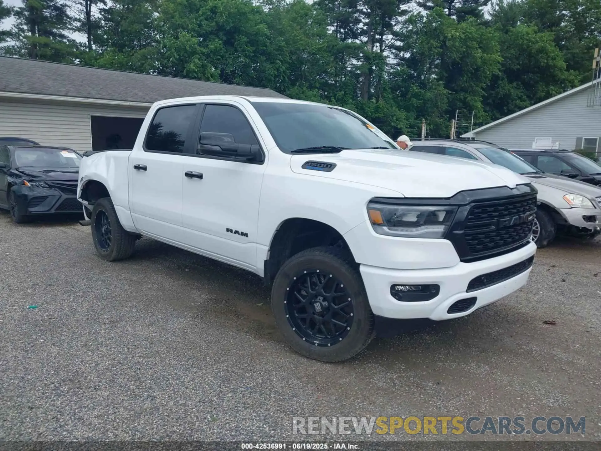 1 Photograph of a damaged car 1C6RRFFG6PN699322 RAM 1500 2023
