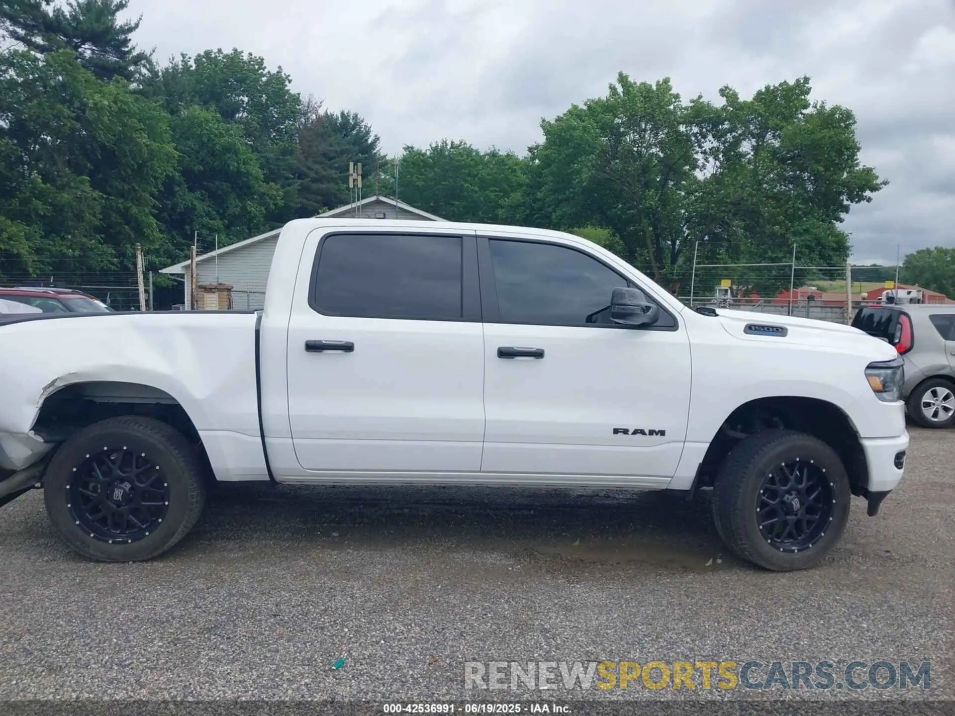 13 Photograph of a damaged car 1C6RRFFG6PN699322 RAM 1500 2023