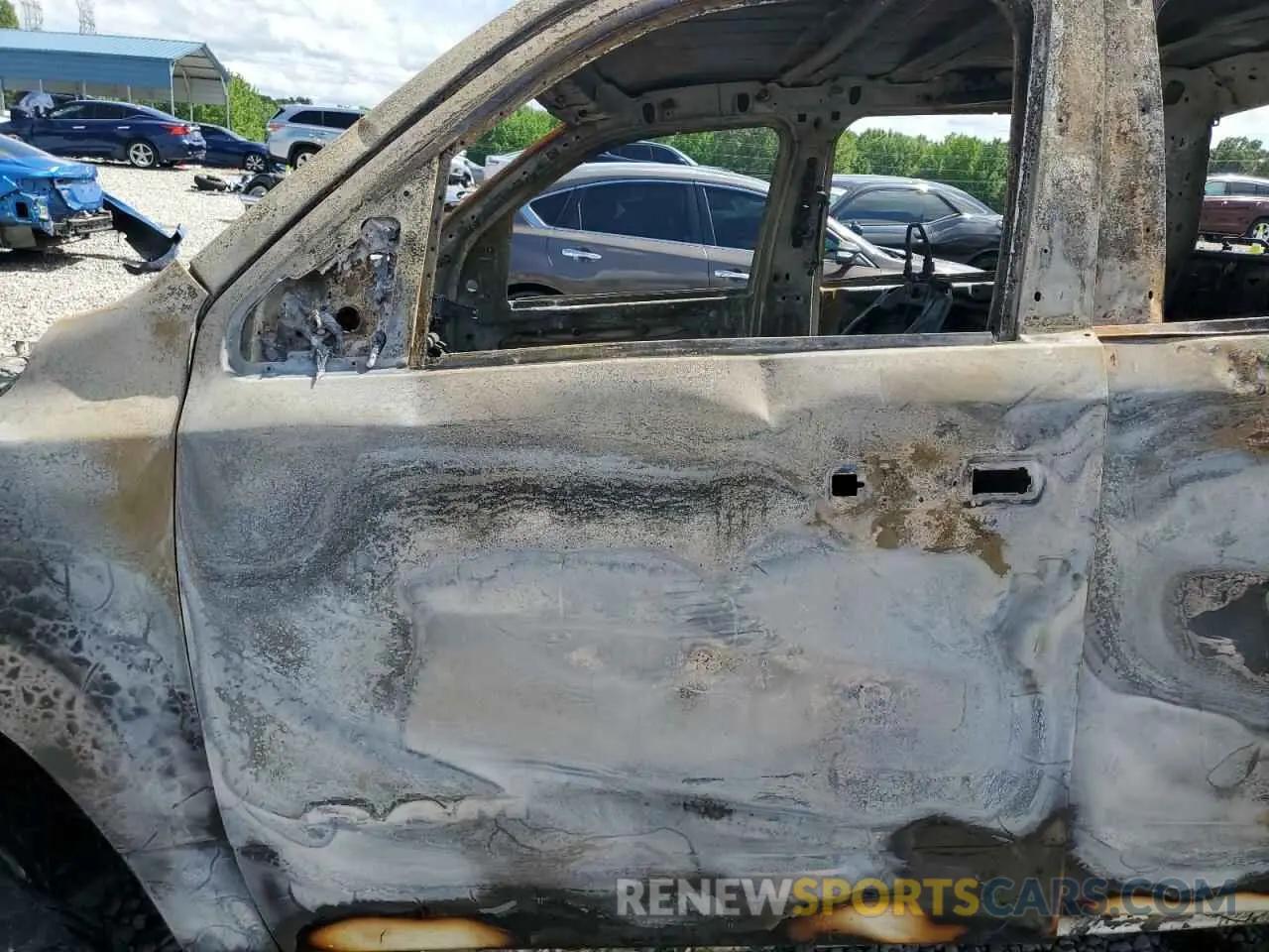 7 Photograph of a damaged car 1C6SRFFT0PN580275 RAM 1500 2023