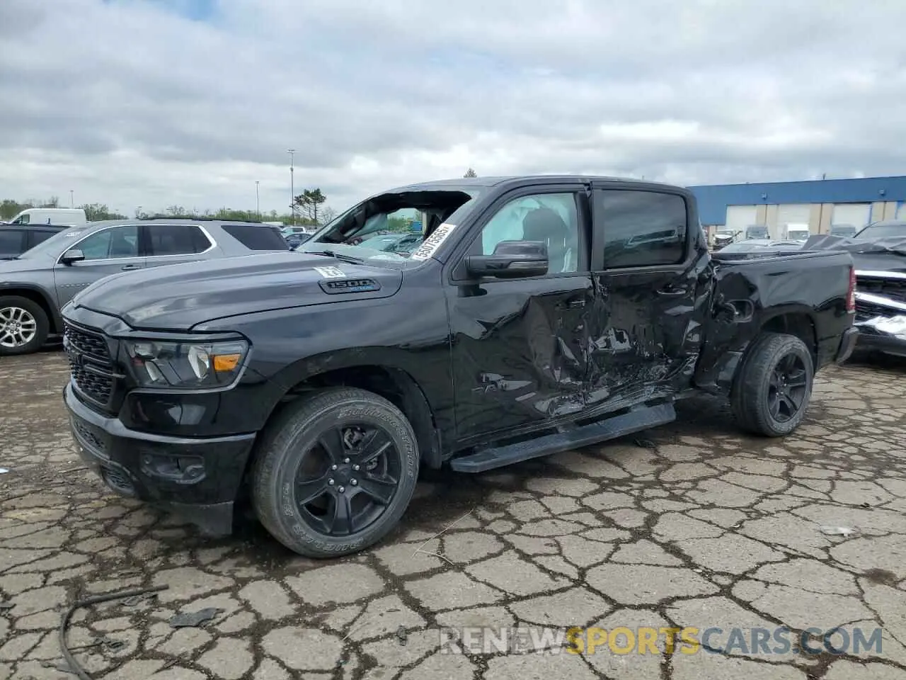 1 Photograph of a damaged car 1C6SRFFT0PN651992 RAM 1500 2023