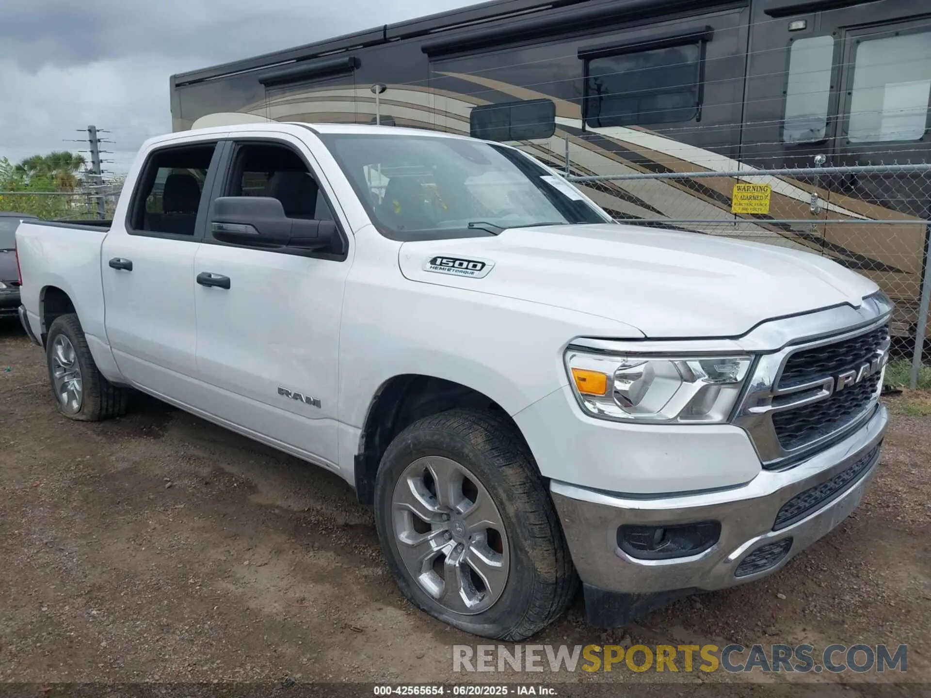 1 Photograph of a damaged car 1C6SRFFT0PN702987 RAM 1500 2023