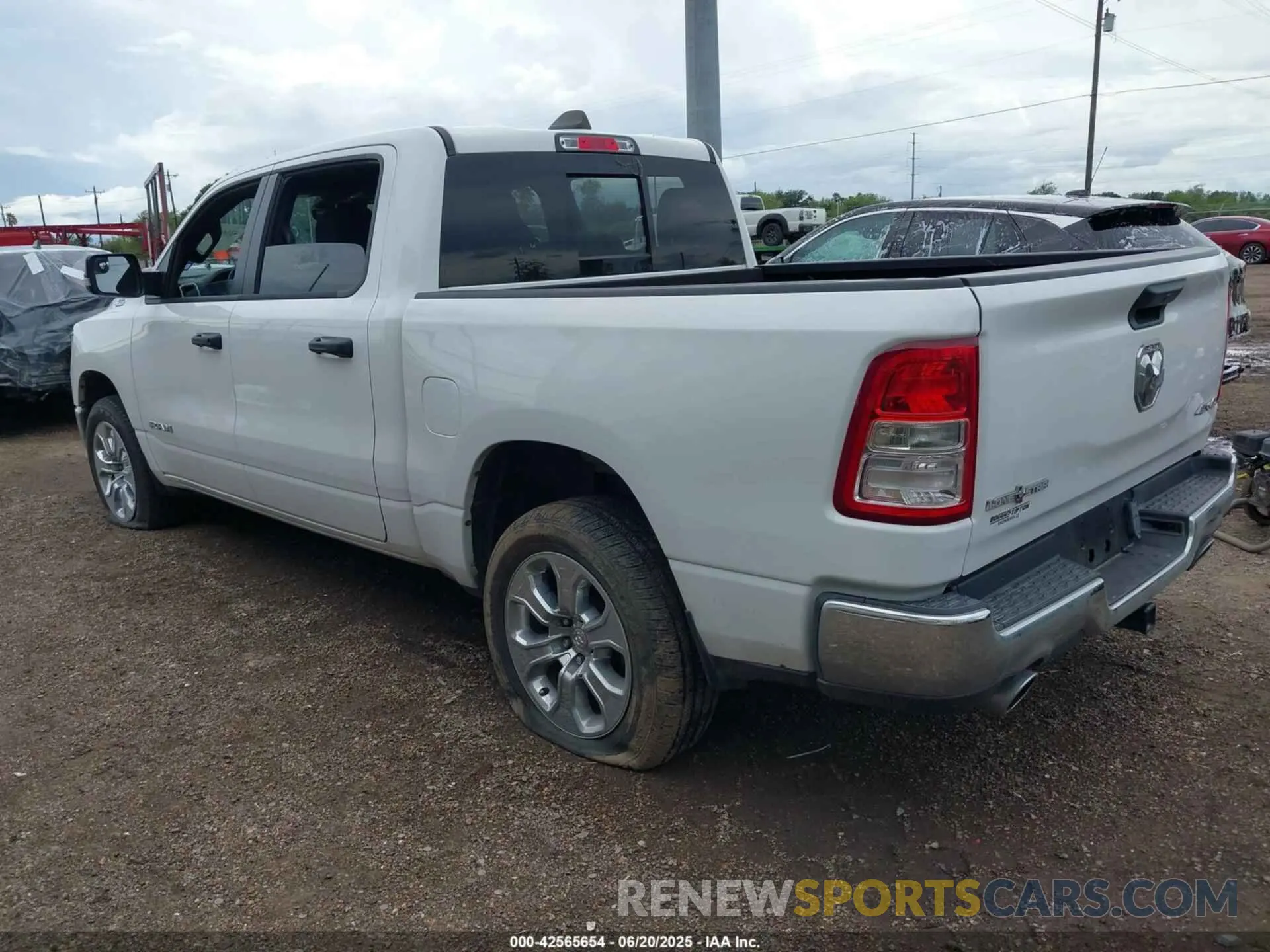 13 Photograph of a damaged car 1C6SRFFT0PN702987 RAM 1500 2023