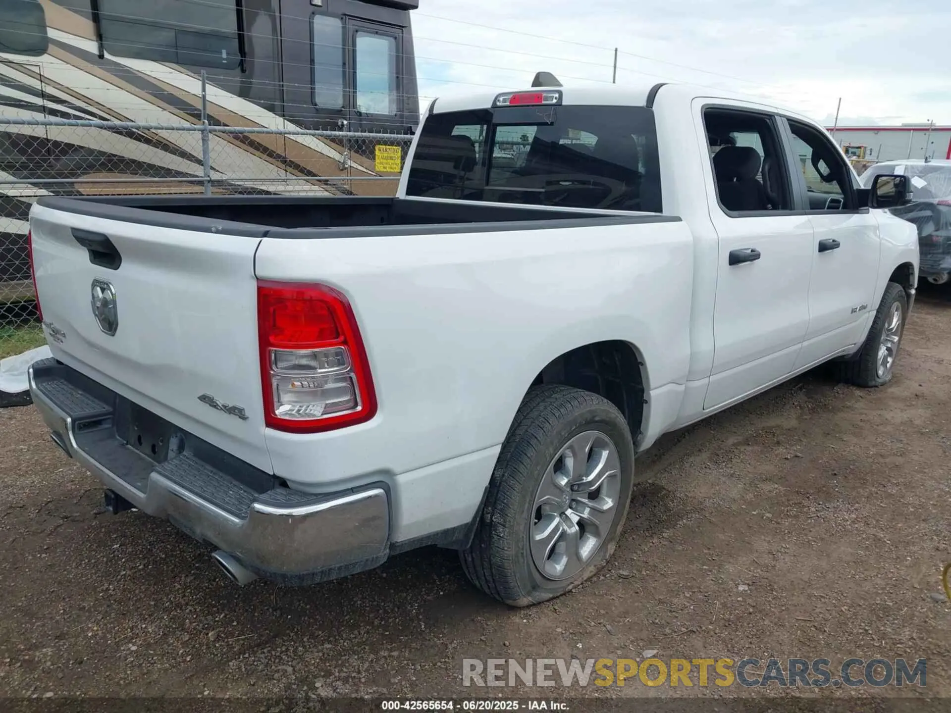 4 Photograph of a damaged car 1C6SRFFT0PN702987 RAM 1500 2023