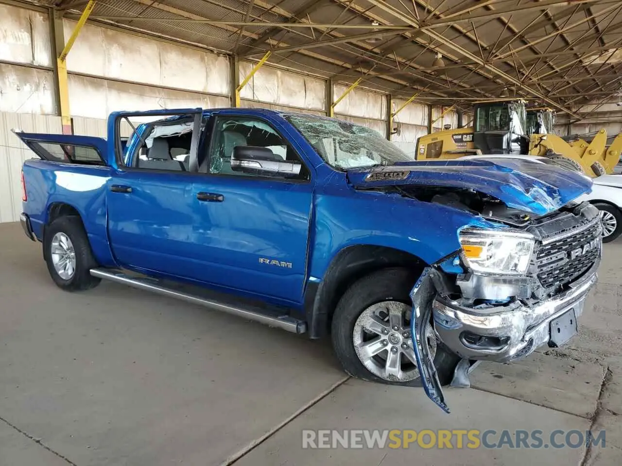 4 Photograph of a damaged car 1C6SRFFT2PN702733 RAM 1500 2023