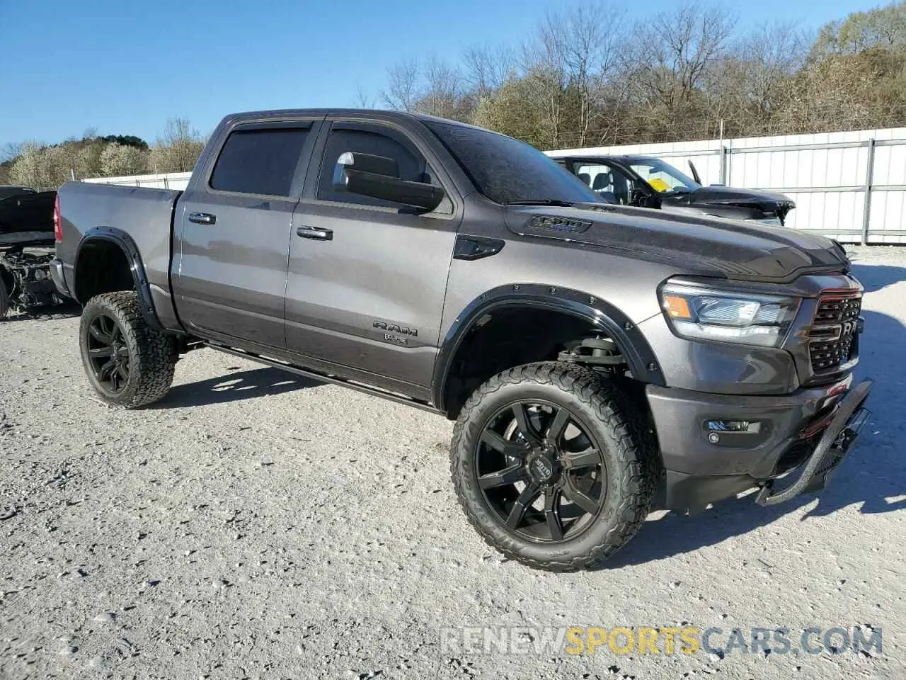 4 Photograph of a damaged car 1C6SRFFT3PN602382 RAM 1500 2023
