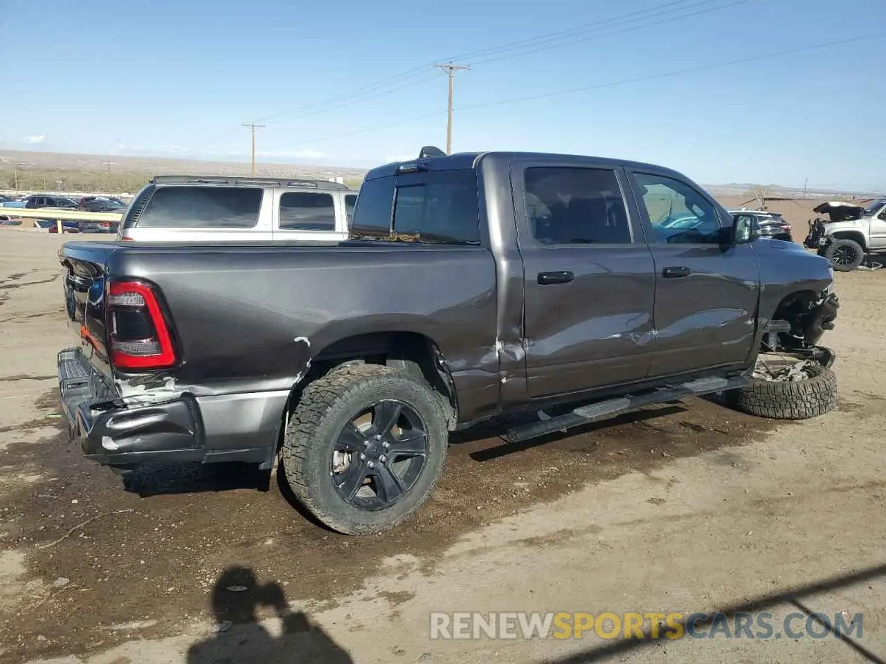 3 Photograph of a damaged car 1C6SRFFT3PN655728 RAM 1500 2023