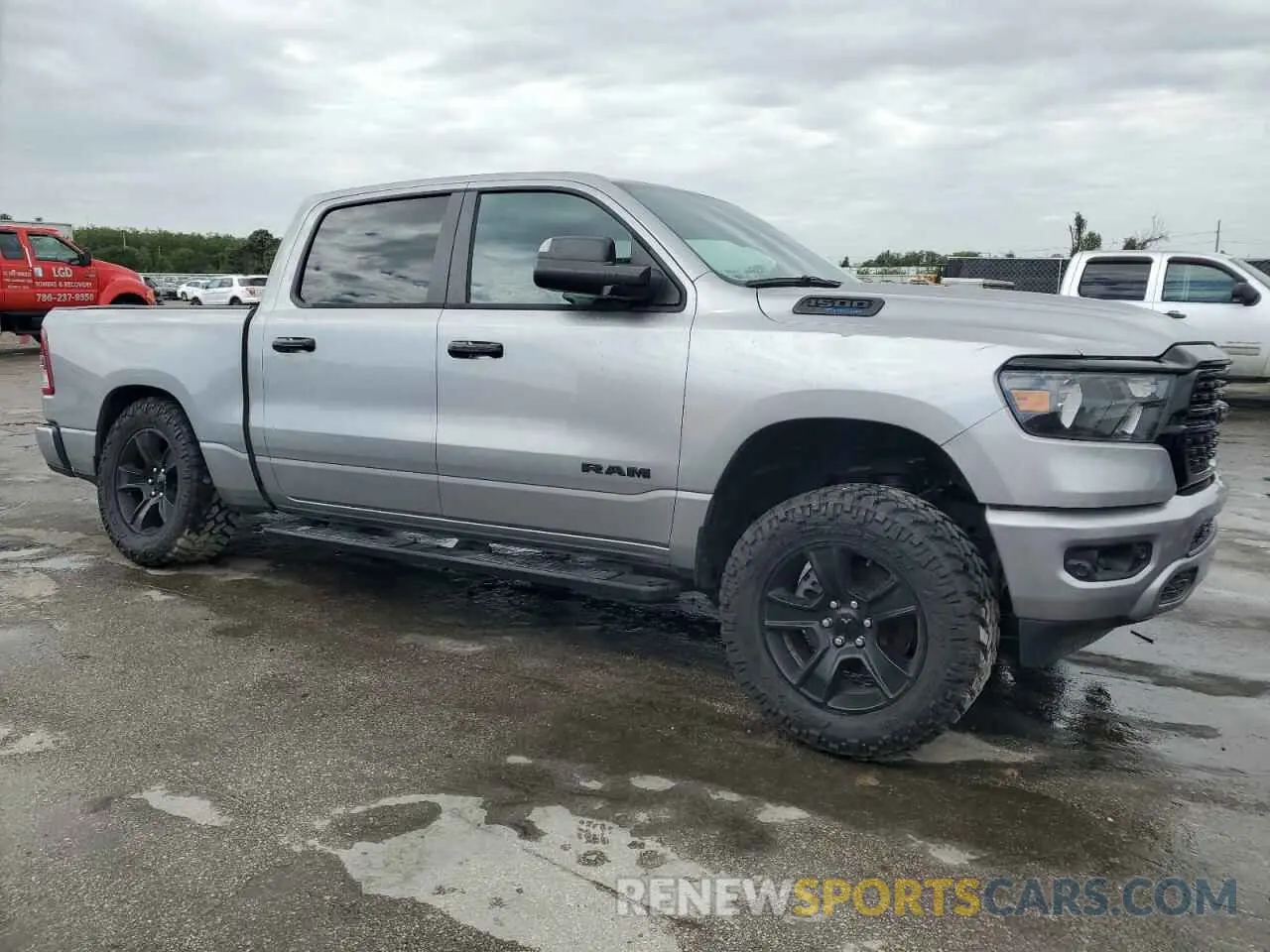 4 Photograph of a damaged car 1C6SRFFT4PN644639 RAM 1500 2023