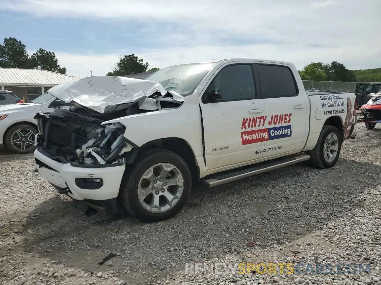 1 Photograph of a damaged car 1C6SRFFT4PN665913 RAM 1500 2023