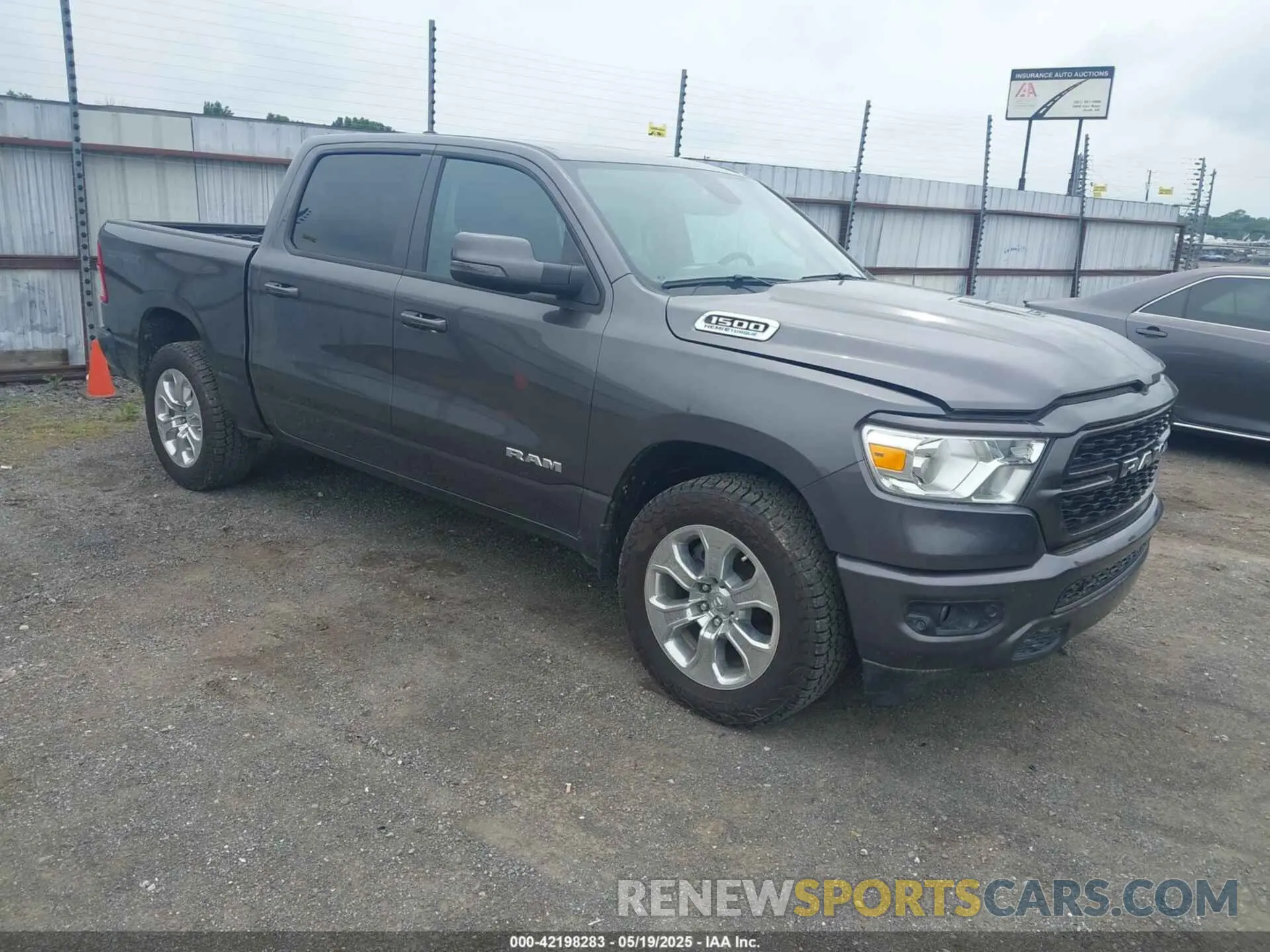 1 Photograph of a damaged car 1C6SRFFT5PN703164 RAM 1500 2023