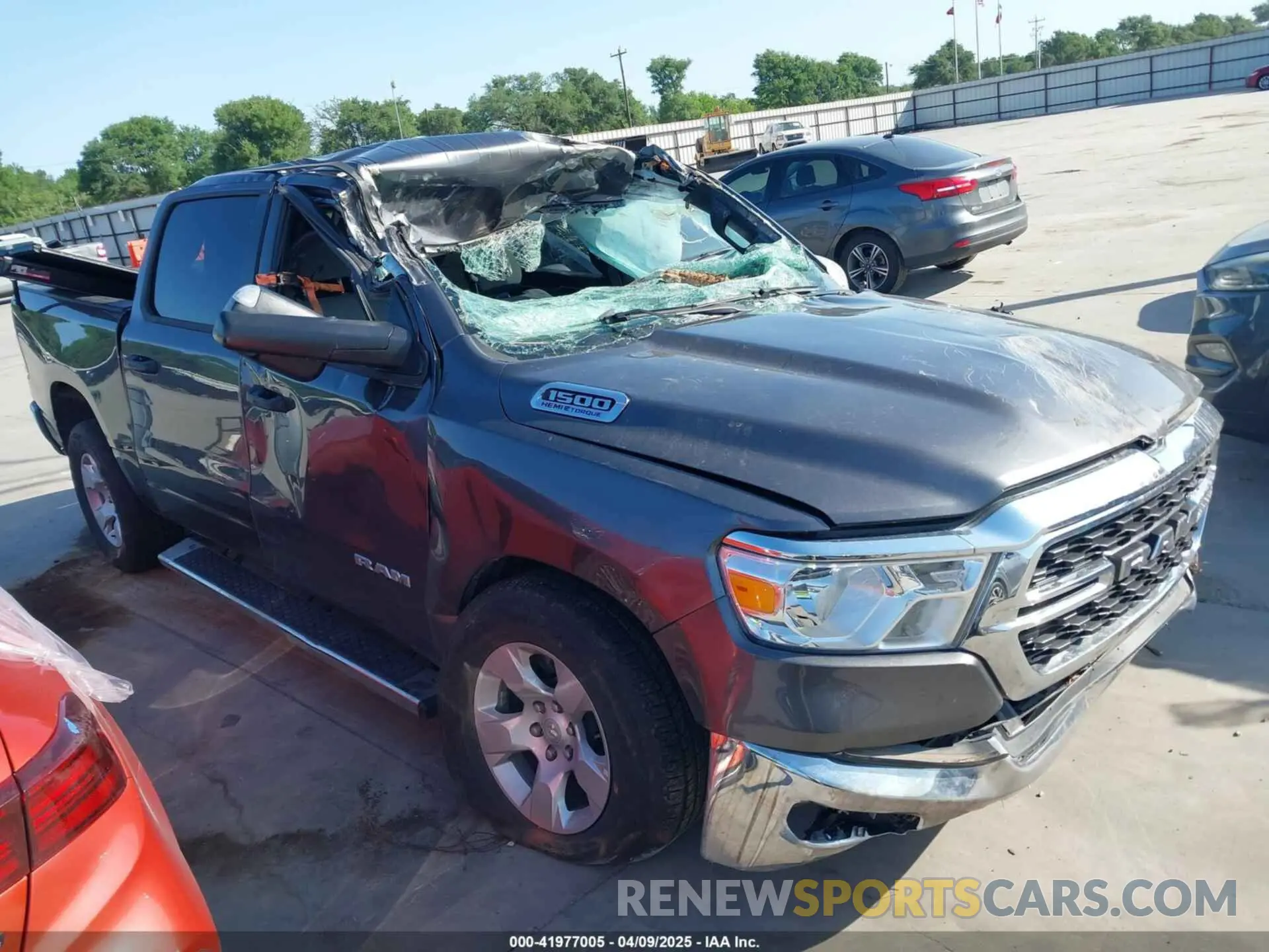 1 Photograph of a damaged car 1C6SRFFT6PN642861 RAM 1500 2023