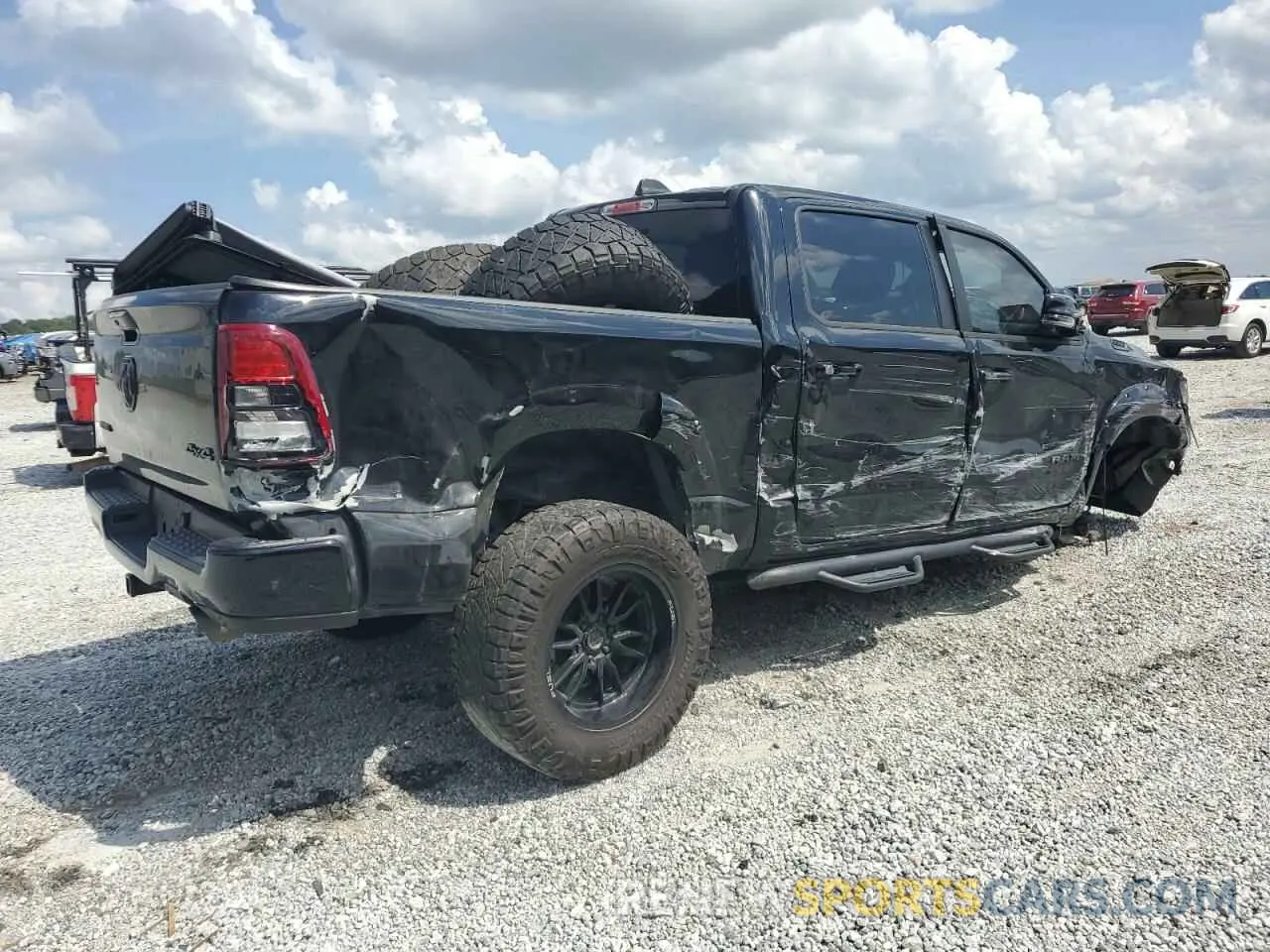 3 Photograph of a damaged car 1C6SRFFT6PN677982 RAM 1500 2023