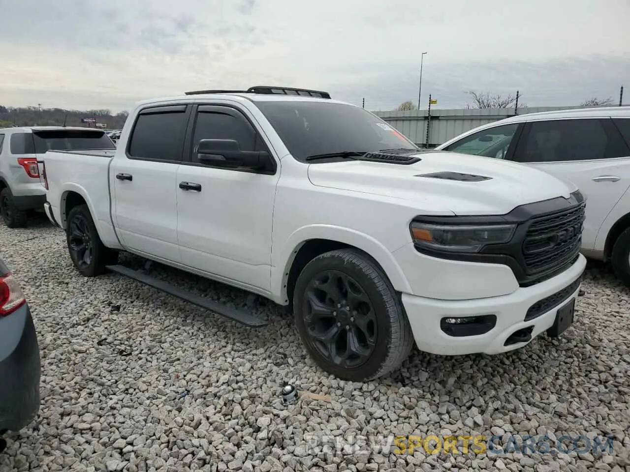 4 Photograph of a damaged car 1C6SRFHT6PN655767 RAM 1500 2023