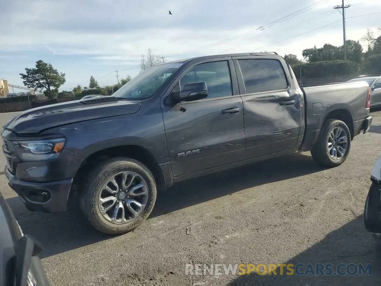 1 Photograph of a damaged car 1C6SRFJT0PN658710 RAM 1500 2023