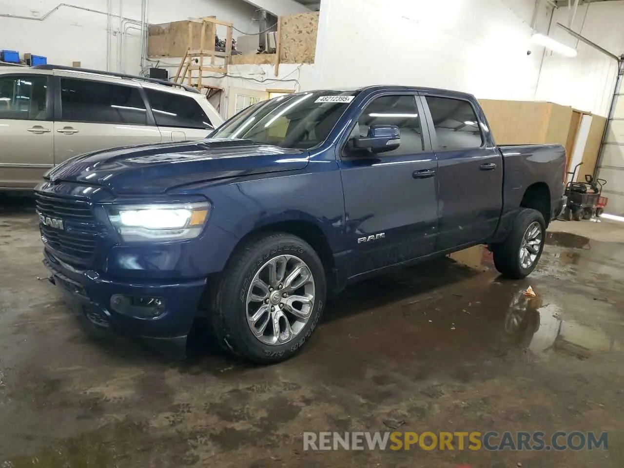 1 Photograph of a damaged car 1C6SRFJT6PN673079 RAM 1500 2023