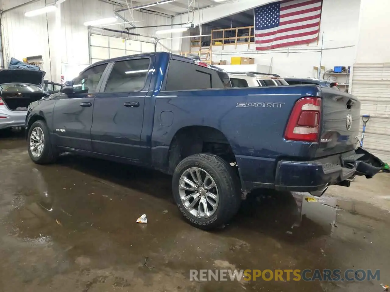 2 Photograph of a damaged car 1C6SRFJT6PN673079 RAM 1500 2023