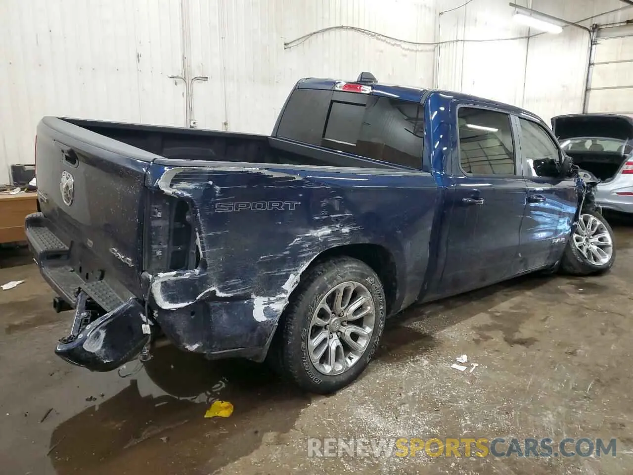 3 Photograph of a damaged car 1C6SRFJT6PN673079 RAM 1500 2023