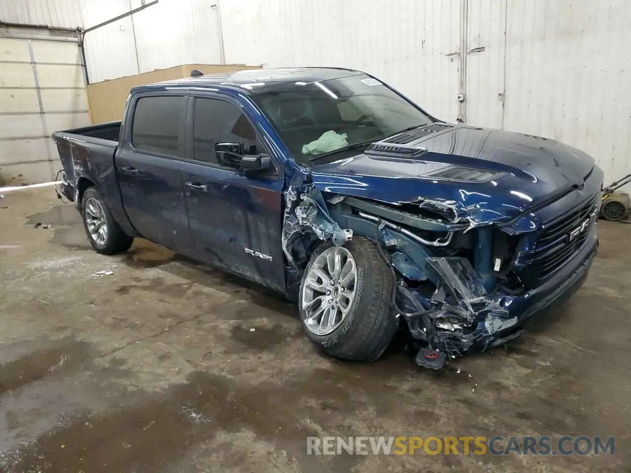 4 Photograph of a damaged car 1C6SRFJT6PN673079 RAM 1500 2023