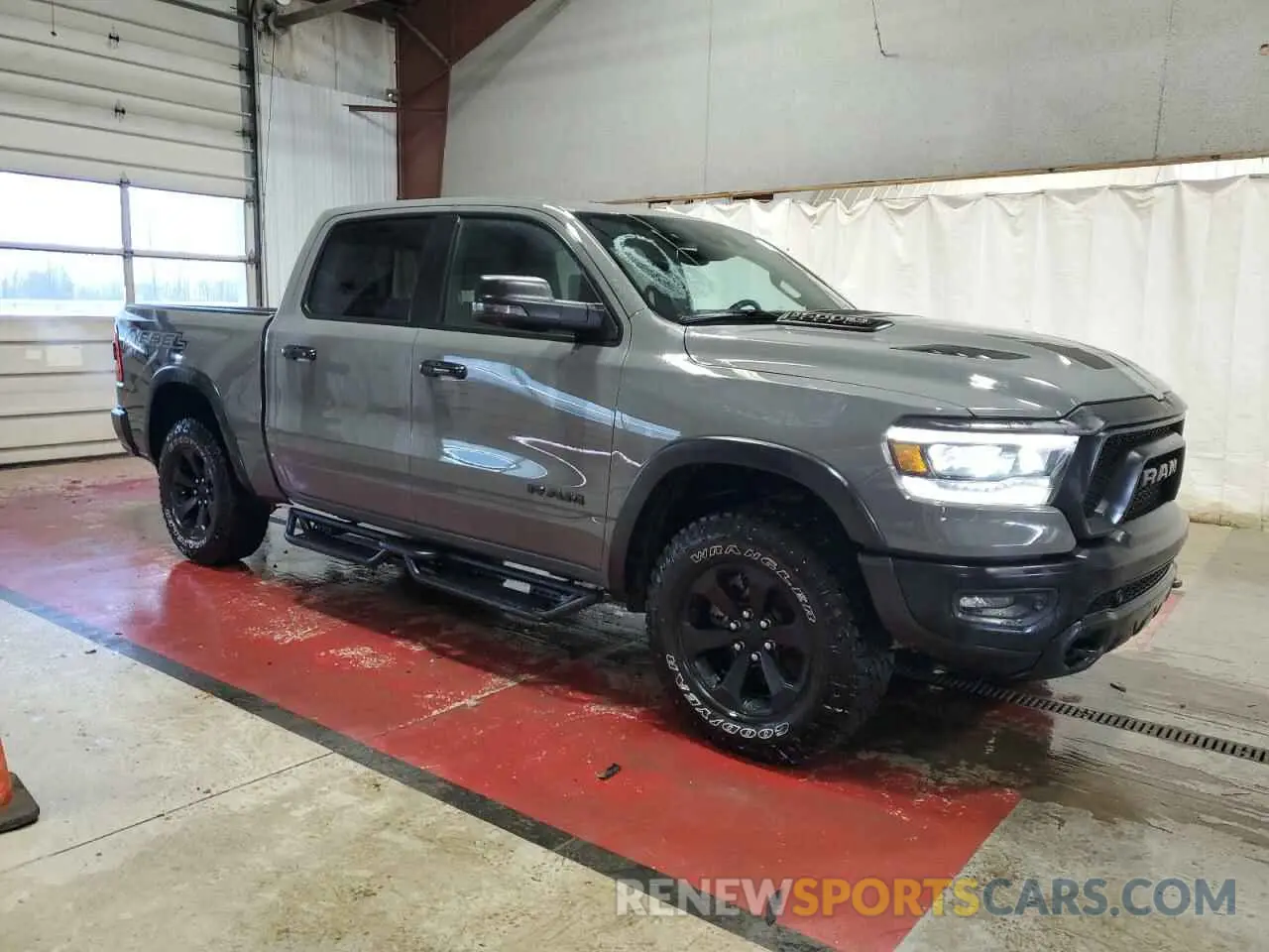 4 Photograph of a damaged car 1C6SRFLT7PN670947 RAM 1500 2023