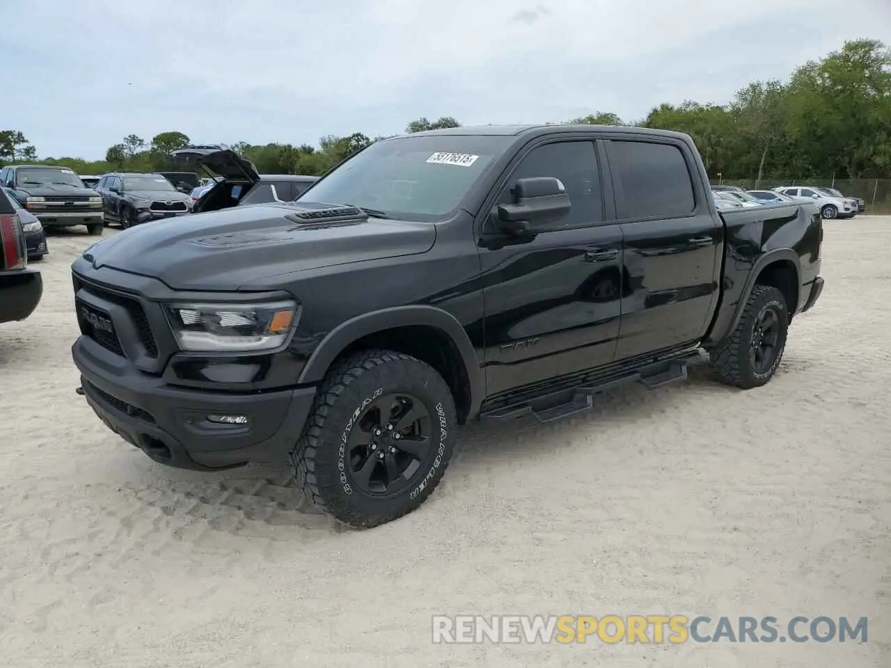 1 Photograph of a damaged car 1C6SRFLT8PN609879 RAM 1500 2023