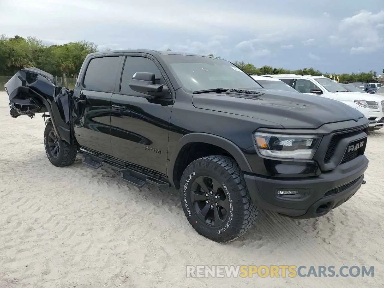 4 Photograph of a damaged car 1C6SRFLT8PN609879 RAM 1500 2023