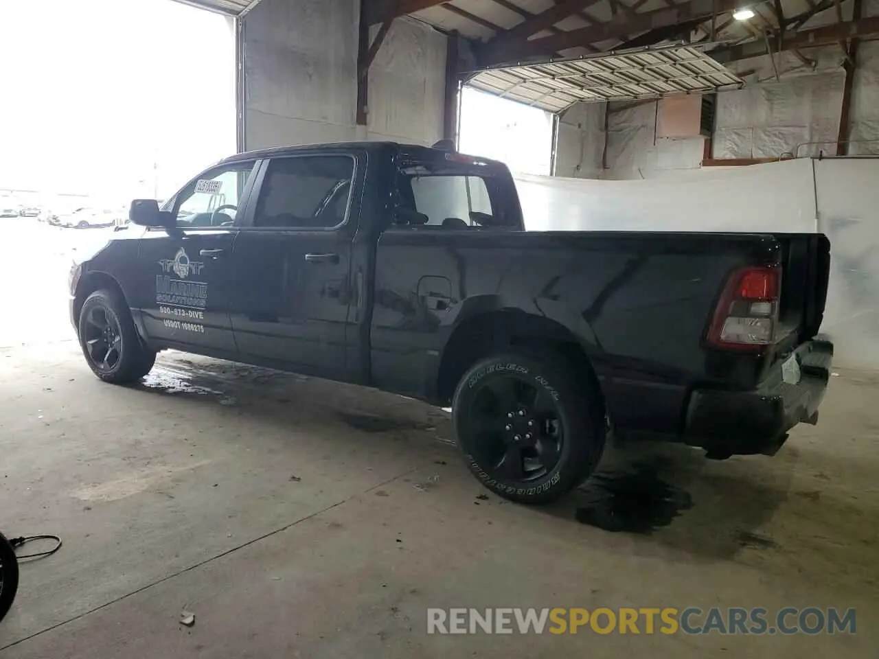 2 Photograph of a damaged car 1C6SRFNT3PN687144 RAM 1500 2023