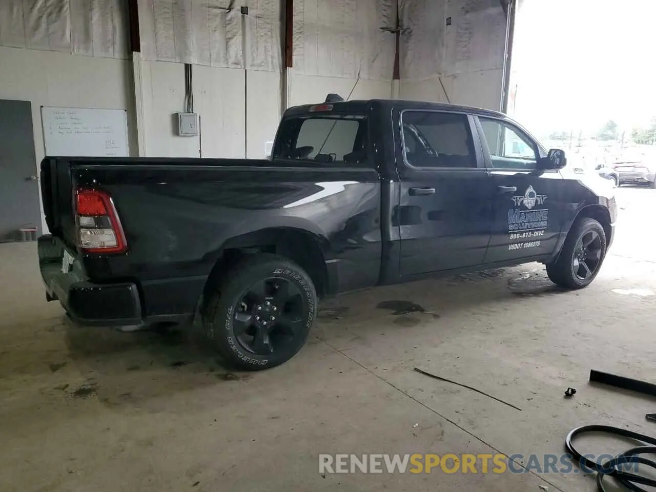 3 Photograph of a damaged car 1C6SRFNT3PN687144 RAM 1500 2023