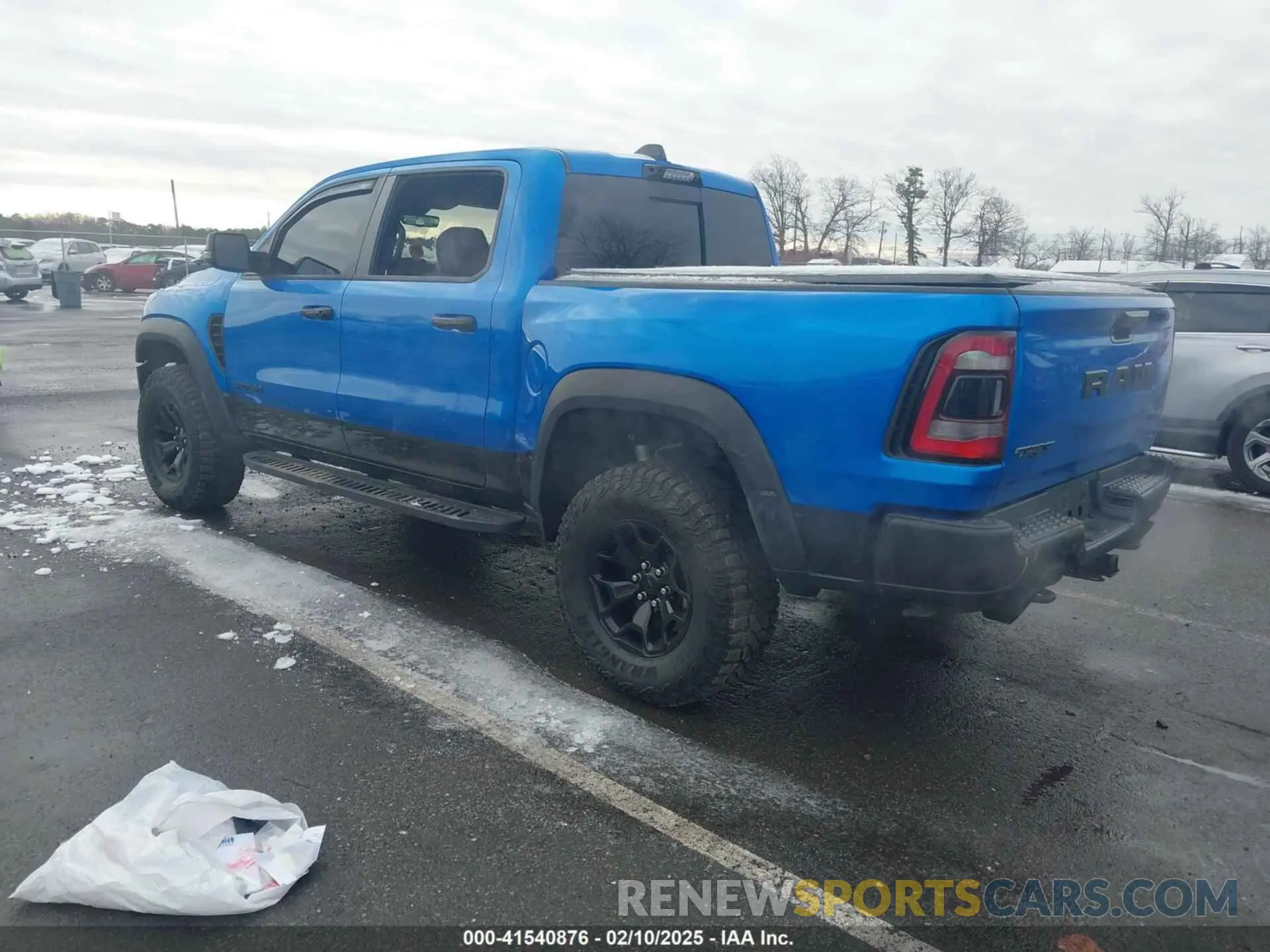 3 Photograph of a damaged car 1C6SRFU98PN529971 RAM 1500 2023