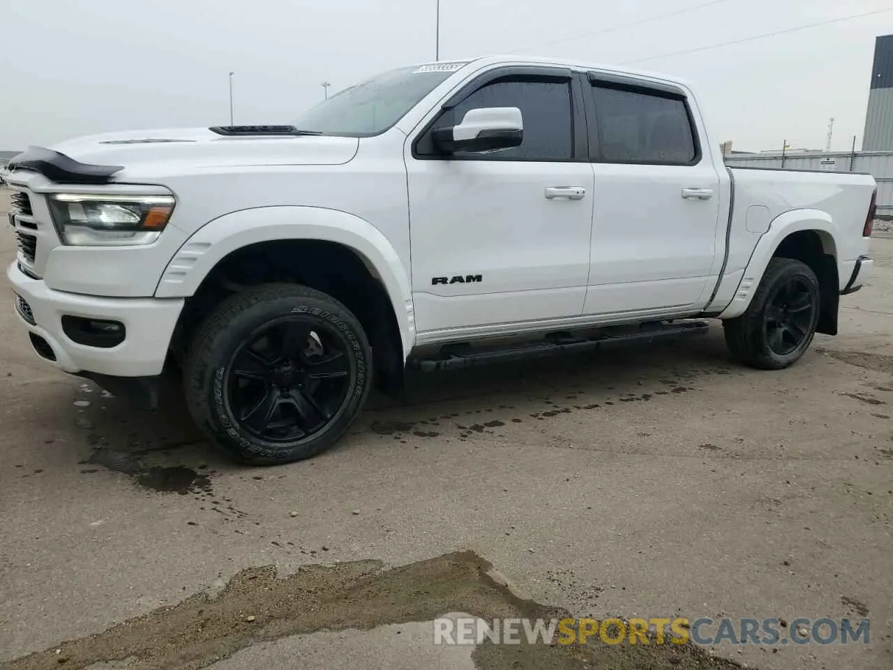 1 Photograph of a damaged car 1C6SRFVT8PN691349 RAM 1500 2023