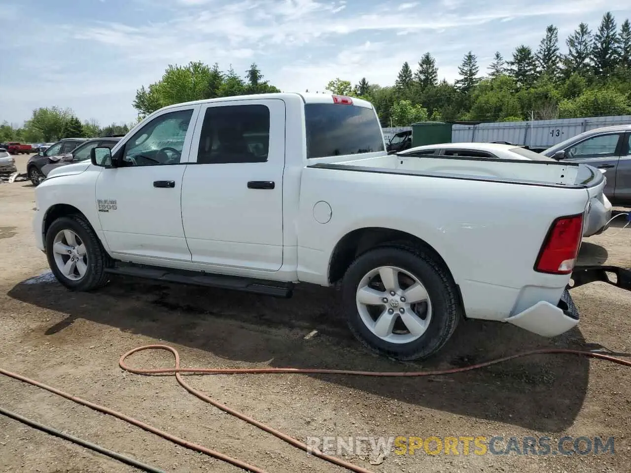 2 Photograph of a damaged car 3C6RR7KG0PG661959 RAM 1500 2023