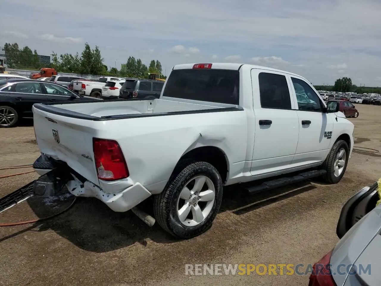 3 Photograph of a damaged car 3C6RR7KG0PG661959 RAM 1500 2023