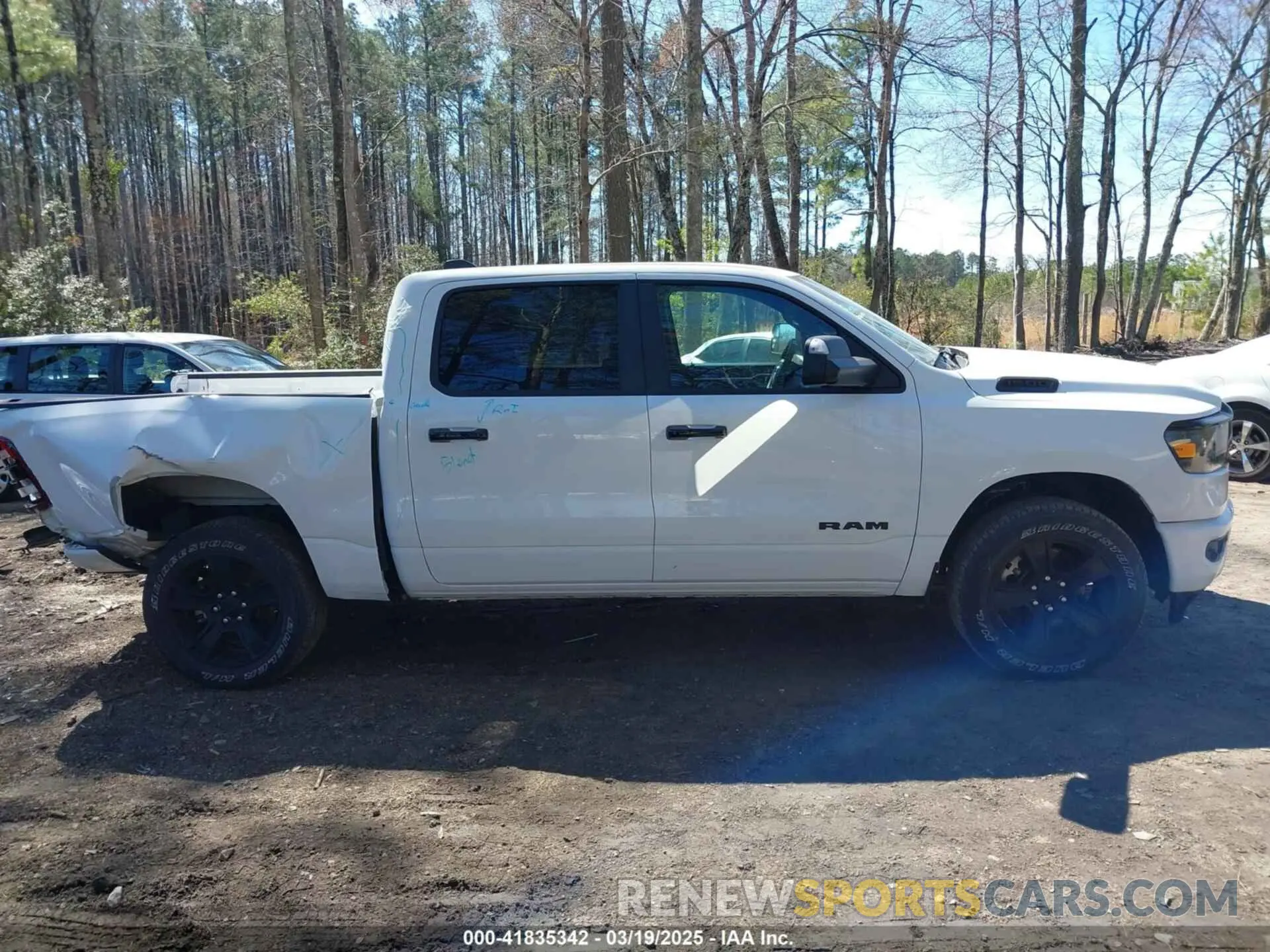 14 Photograph of a damaged car 1C6SRFFT0RN150670 RAM 1500 2024