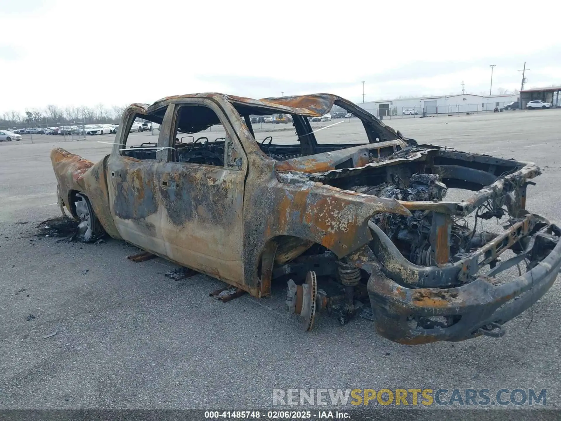 1 Photograph of a damaged car 1C6SRFFT3RN232330 RAM 1500 2024