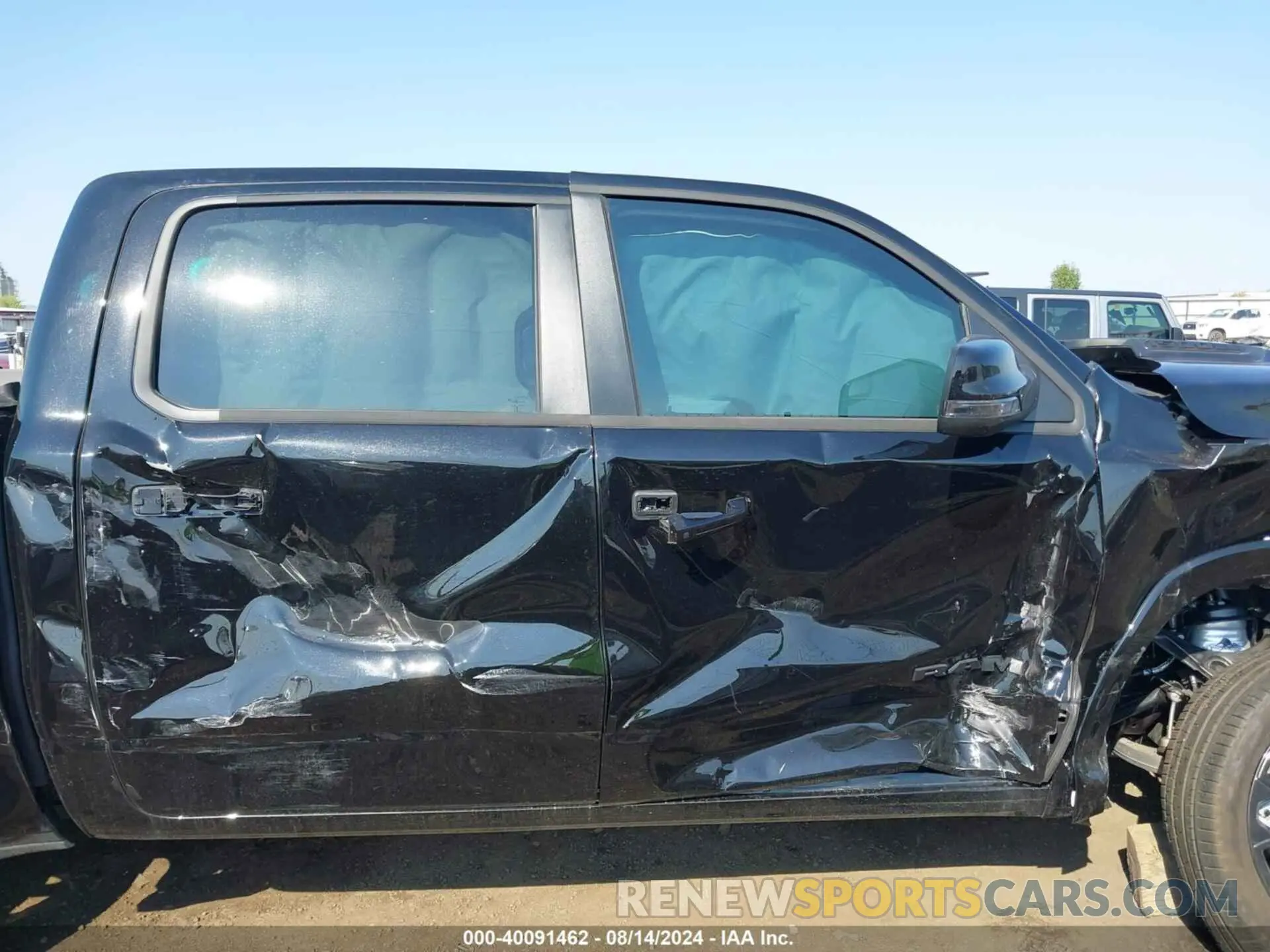 13 Photograph of a damaged car 1C6SRFHT2RN182419 RAM 1500 2024