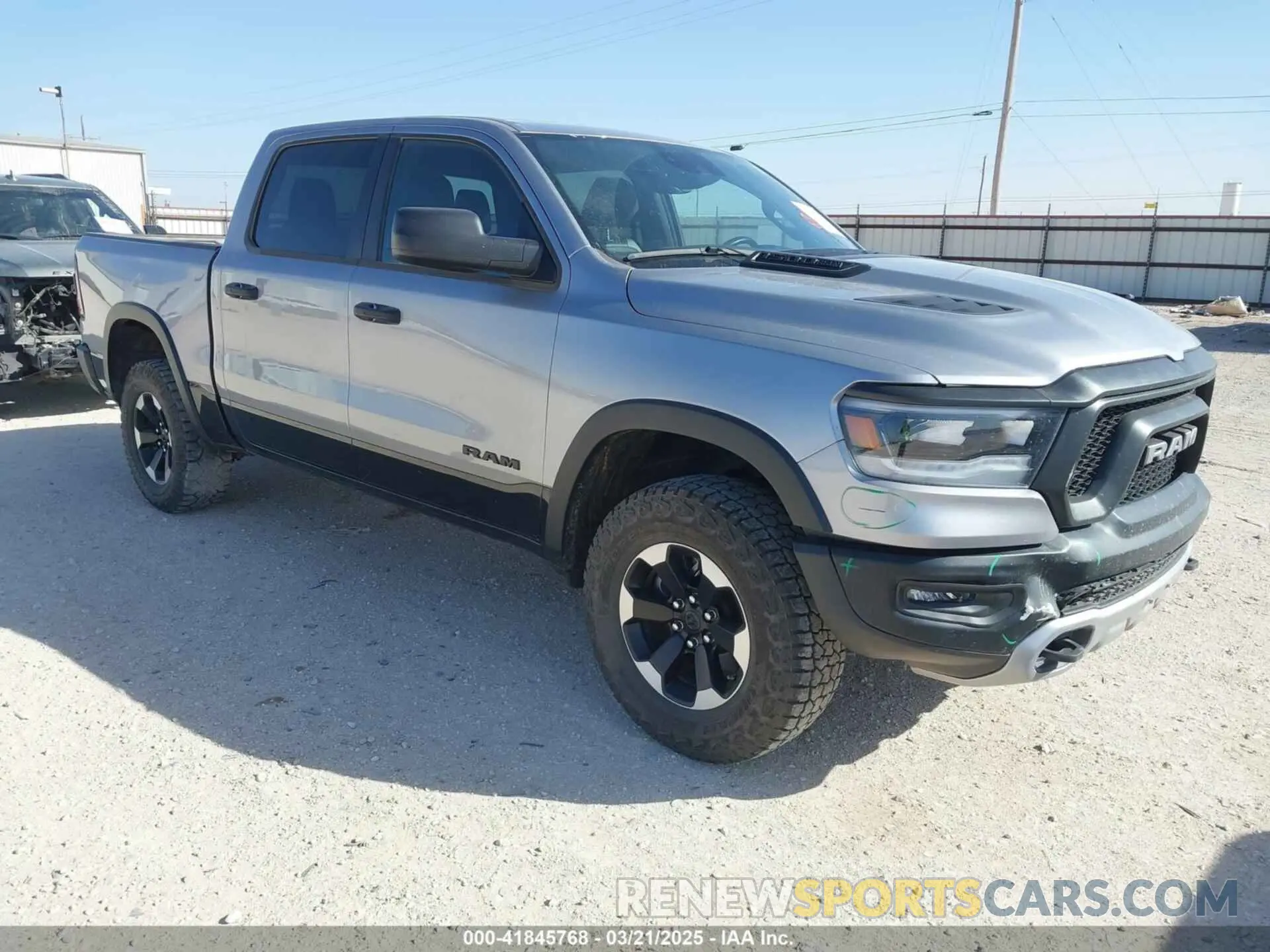 1 Photograph of a damaged car 1C6SRFLT0RN223654 RAM 1500 2024