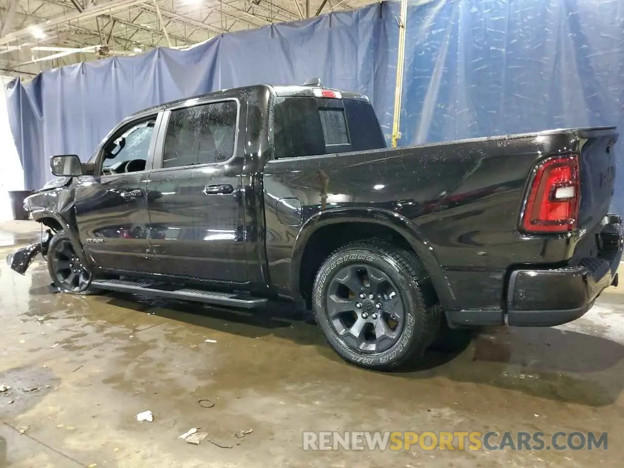 2 Photograph of a damaged car 1C6SRFFP6SN558552 RAM 1500 2025