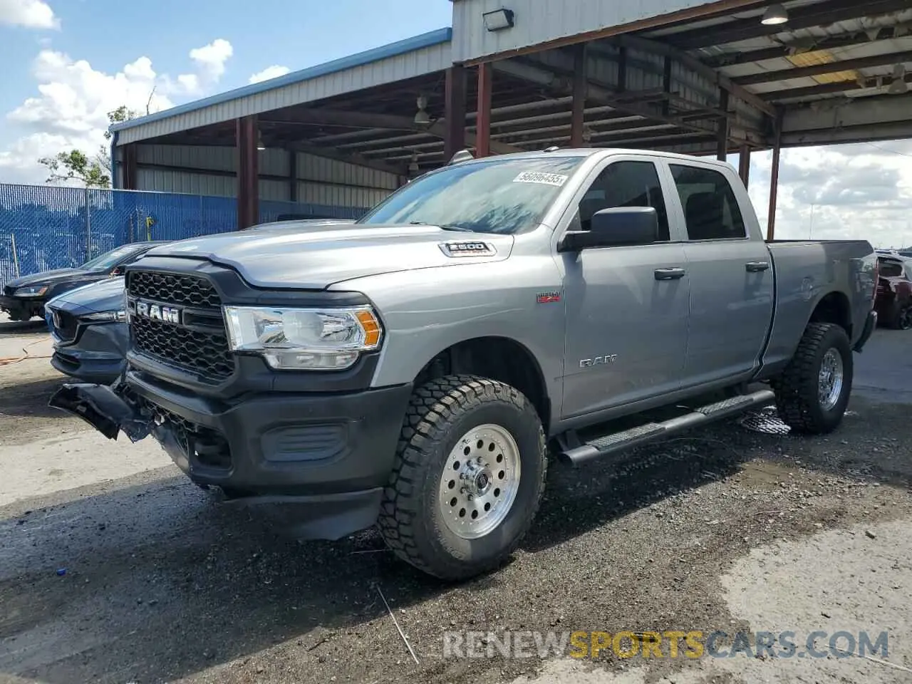 1 Photograph of a damaged car 3C6UR5CJ3KG556303 RAM 2500 2019