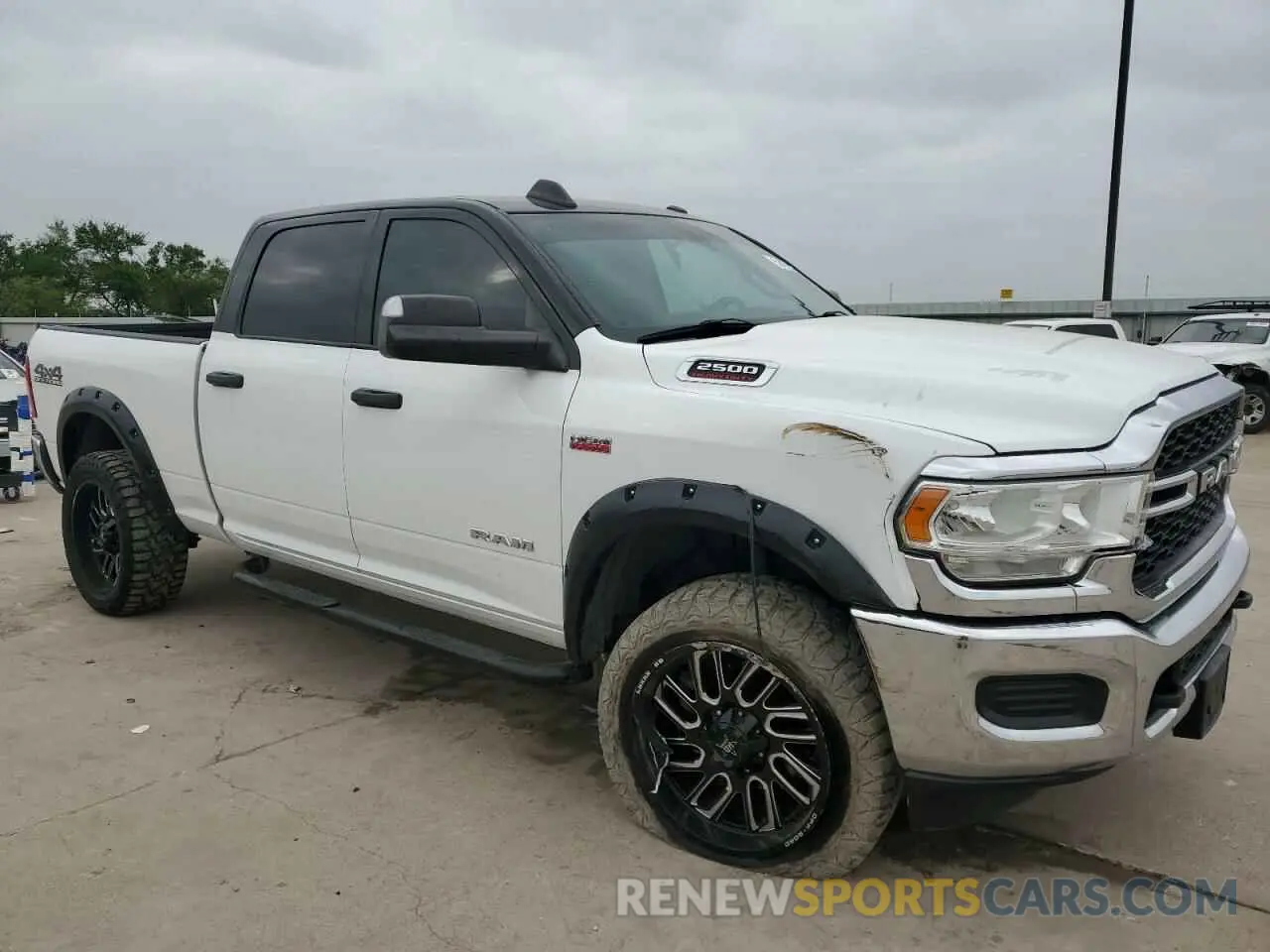 4 Photograph of a damaged car 3C6UR5CJ4KG667037 RAM 2500 2019