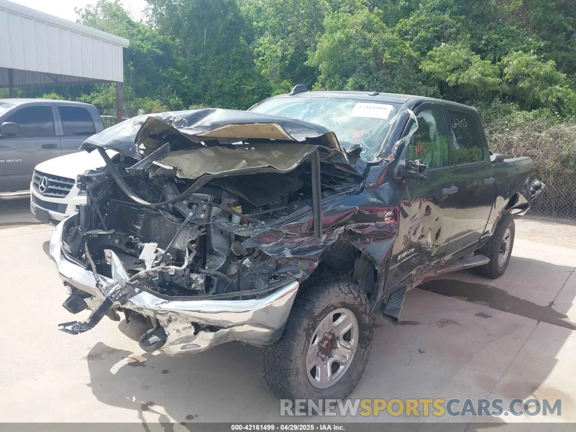 2 Photograph of a damaged car 3C6UR5CL9KG706769 RAM 2500 2019