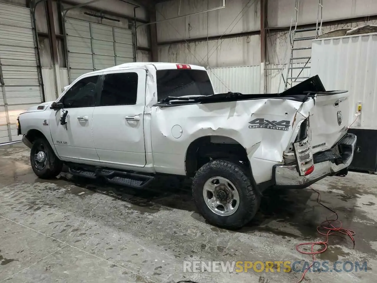 2 Photograph of a damaged car 3C6UR5DL2KG586389 RAM 2500 2019