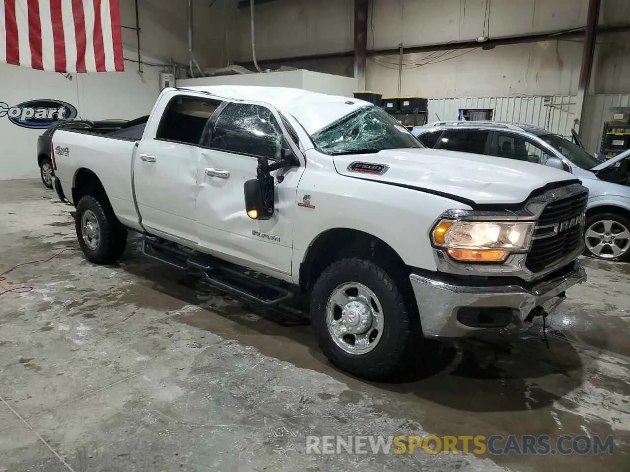 4 Photograph of a damaged car 3C6UR5DL2KG586389 RAM 2500 2019
