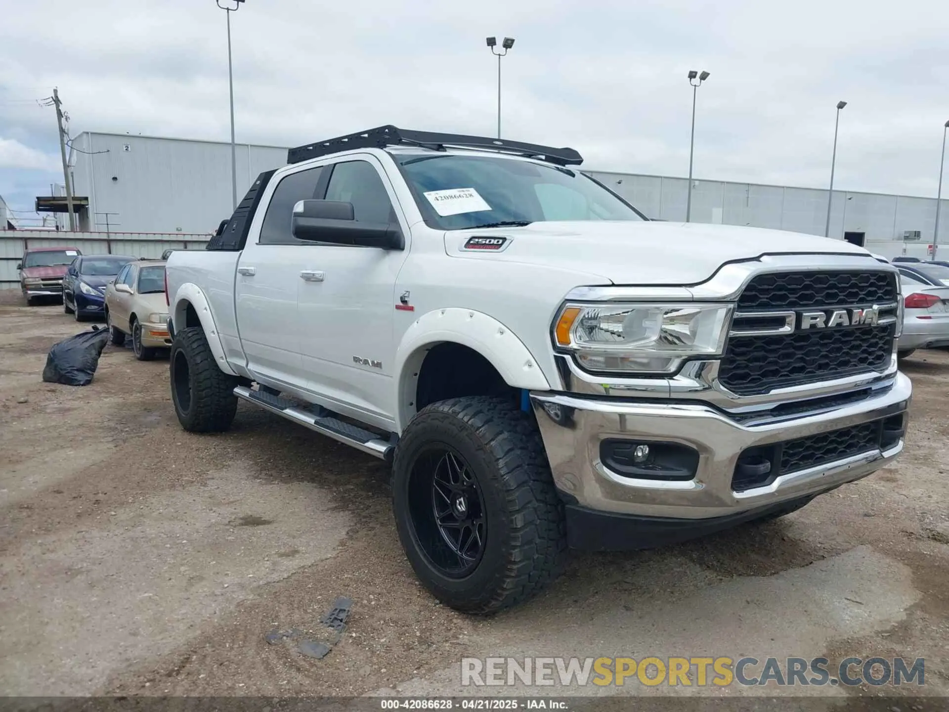 1 Photograph of a damaged car 3C6UR5DL7KG587151 RAM 2500 2019