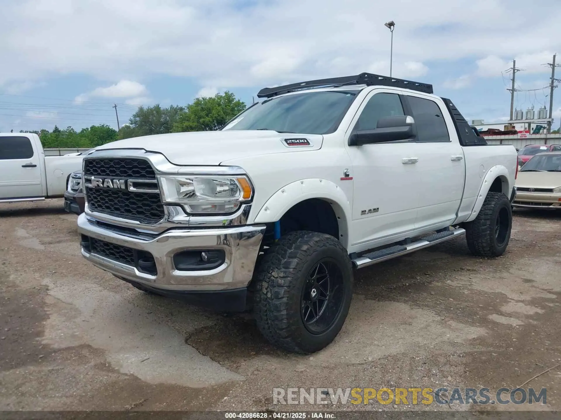 2 Photograph of a damaged car 3C6UR5DL7KG587151 RAM 2500 2019