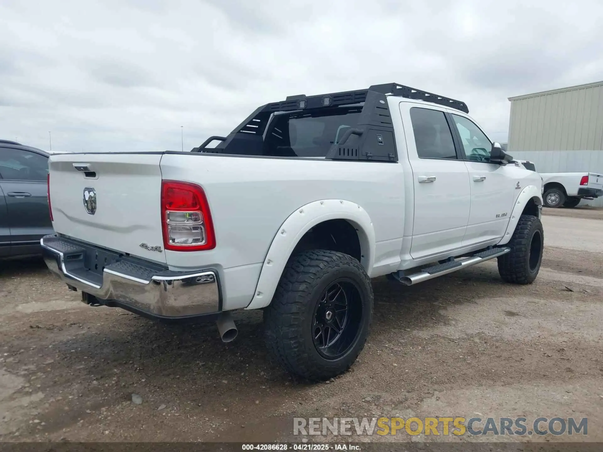4 Photograph of a damaged car 3C6UR5DL7KG587151 RAM 2500 2019