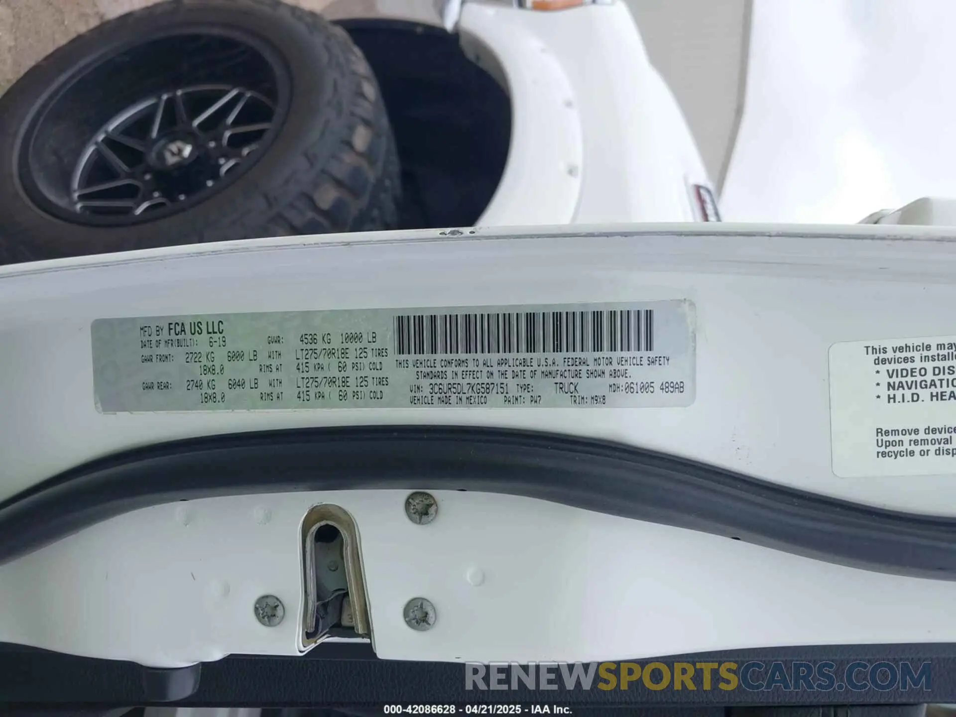 9 Photograph of a damaged car 3C6UR5DL7KG587151 RAM 2500 2019
