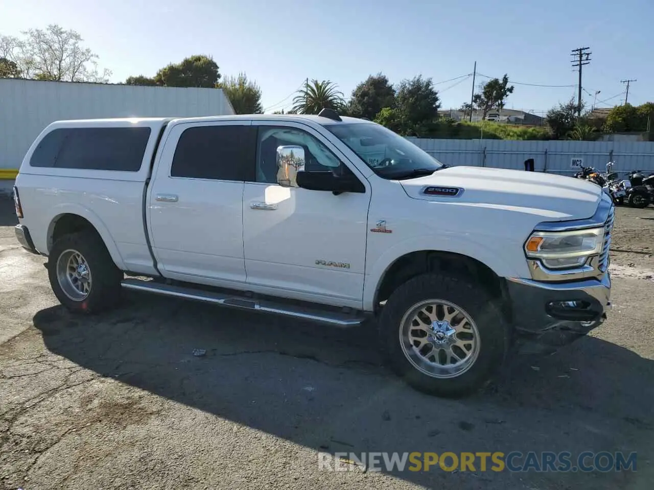 4 Photograph of a damaged car 3C6UR5FL3KG553723 RAM 2500 2019