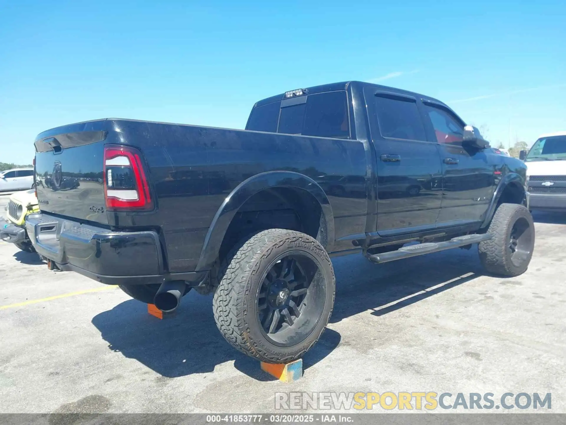 4 Photograph of a damaged car 3C6UR5FLXKG710325 RAM 2500 2019
