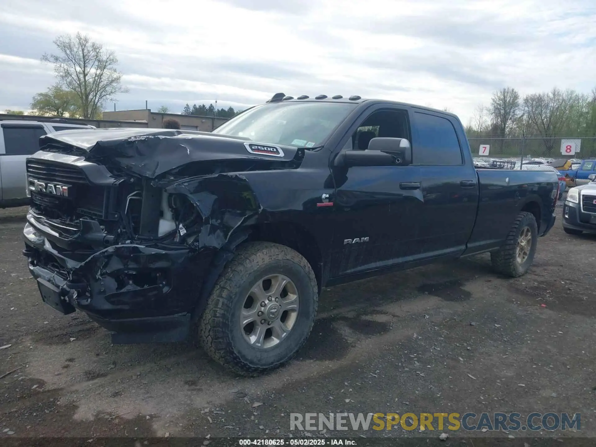 2 Photograph of a damaged car 3C6UR5JL0KG700152 RAM 2500 2019