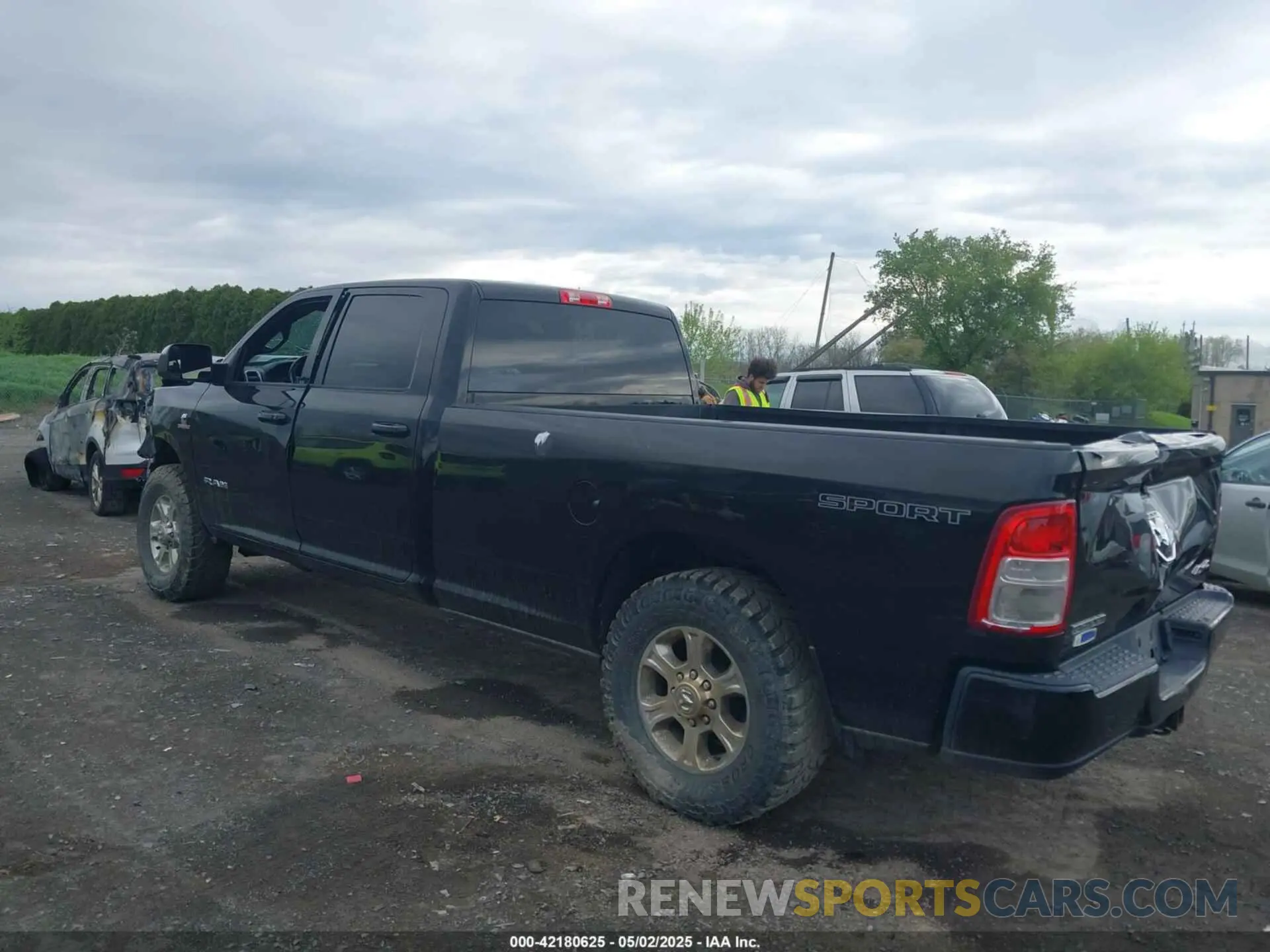 3 Photograph of a damaged car 3C6UR5JL0KG700152 RAM 2500 2019